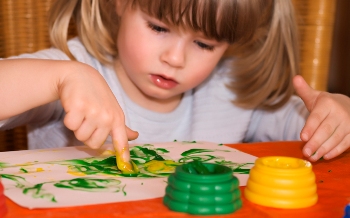 This photo of a young girl hard at work finger-painting was taken by photographer Marja Flick-Buijs from Aalsmeer, Netherlands.